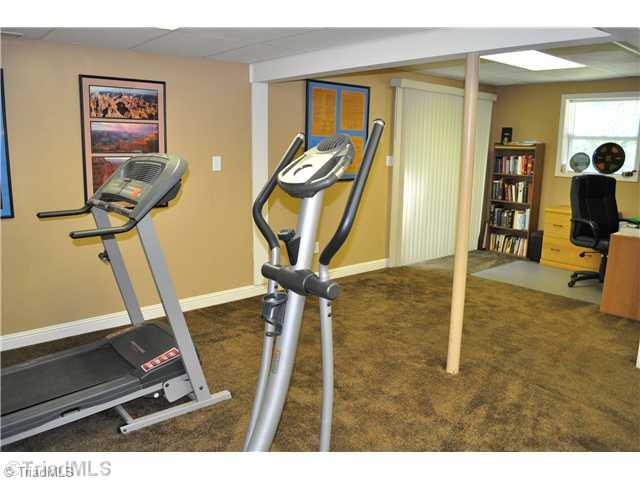607 Silver Ridge Drive Lexington, NC 27292 - Photo 13 of 15 Den/Family/Great Room. Lower level den currently used as exercise and office area.