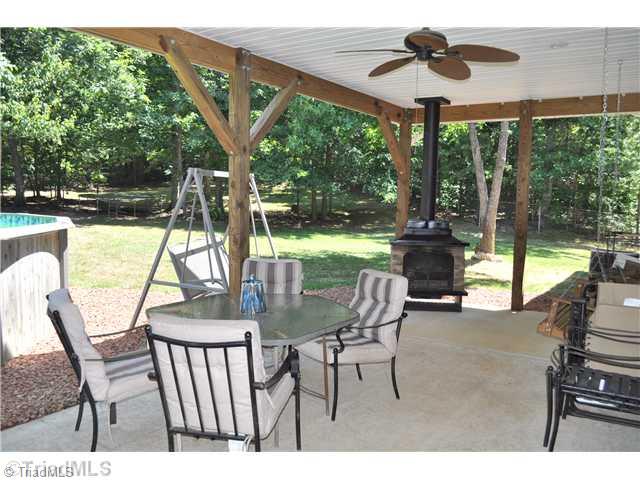 607 Silver Ridge Drive Lexington, NC 27292 - Photo 3 of 15 Patio/Deck. Relax or entertain on this extra nice covered patio with freestanding fireplace.
