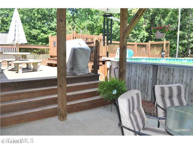 607 Silver Ridge Drive Lexington, NC 27292 - Photo 4 of 15 Swimming Pool/Hot Tub/Sauna. Additional deck leading to pool area from covered patio.