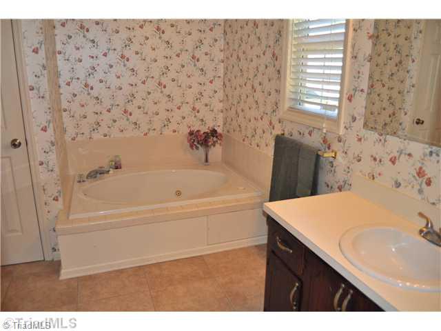 607 Silver Ridge Drive Lexington, NC 27292 - Photo 9 of 15 Master Bath/Spa. Master bathroom has updated tile floor, jetted garden tub, and recent paint.