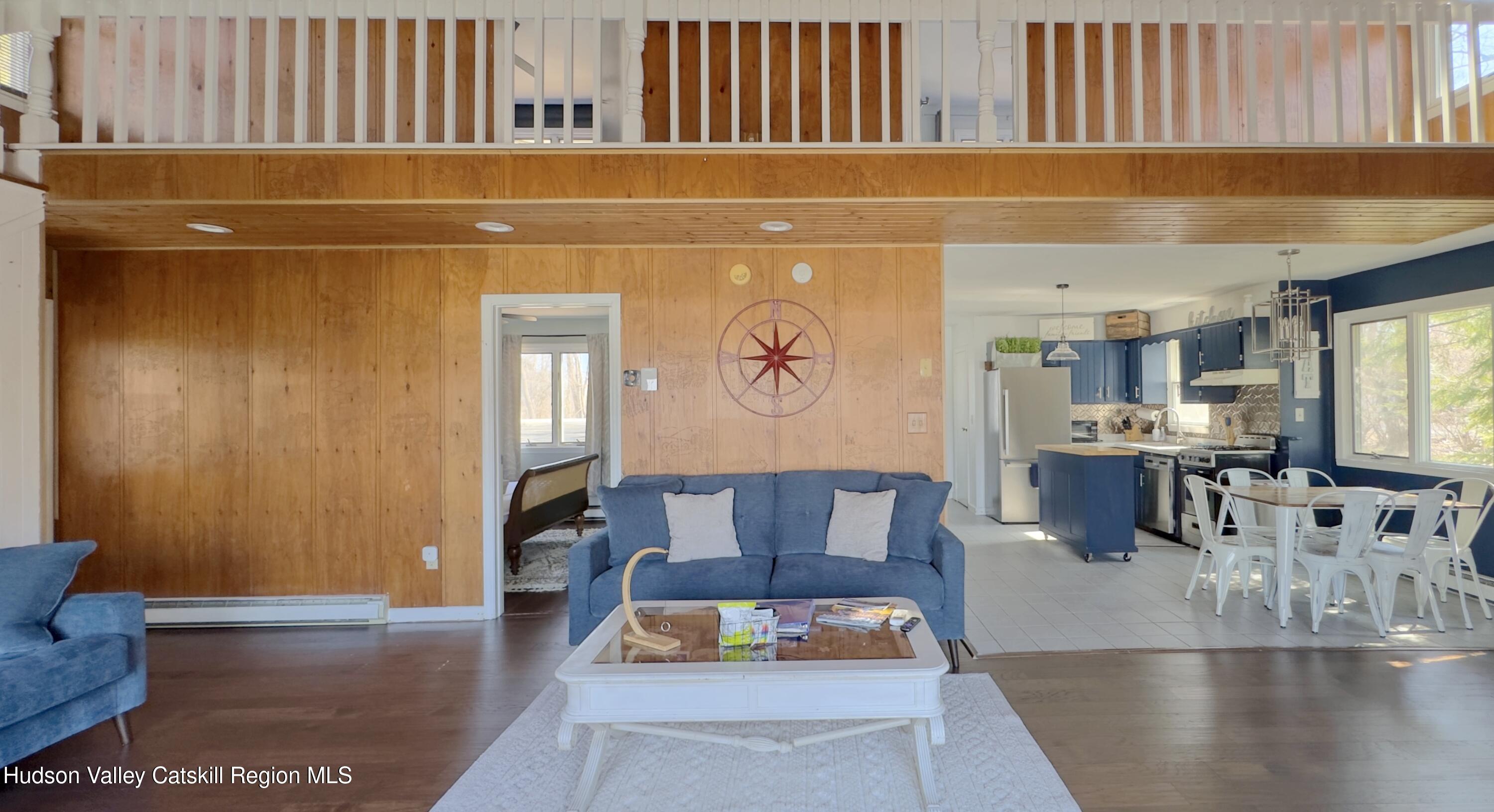 87 Sleepy Hollow Road Athens, NY 12015 - Photo 11 of 42 a living room with furniture and wooden floor