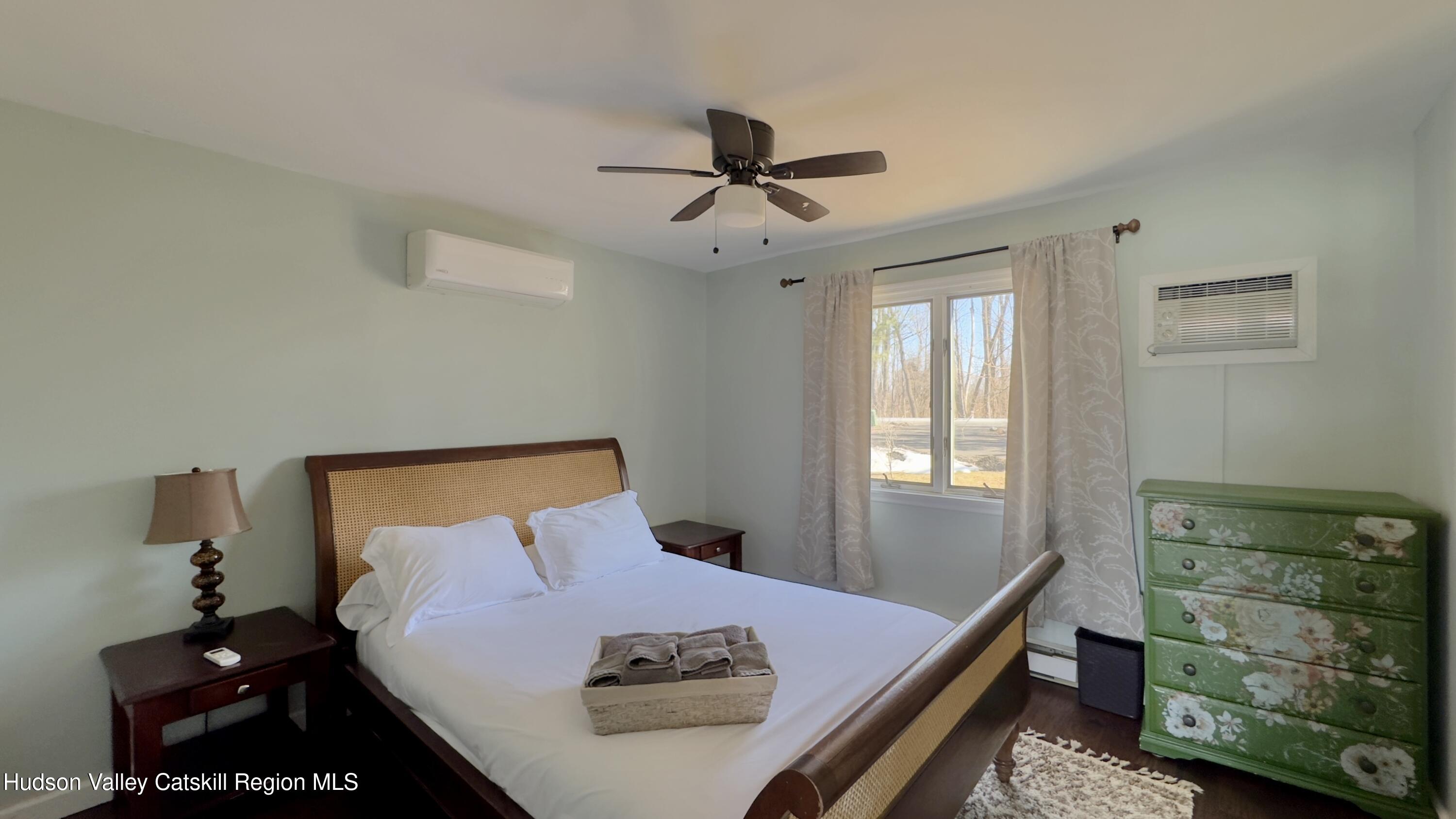 87 Sleepy Hollow Road Athens, NY 12015 - Photo 13 of 42 a bed room with a bed and a window