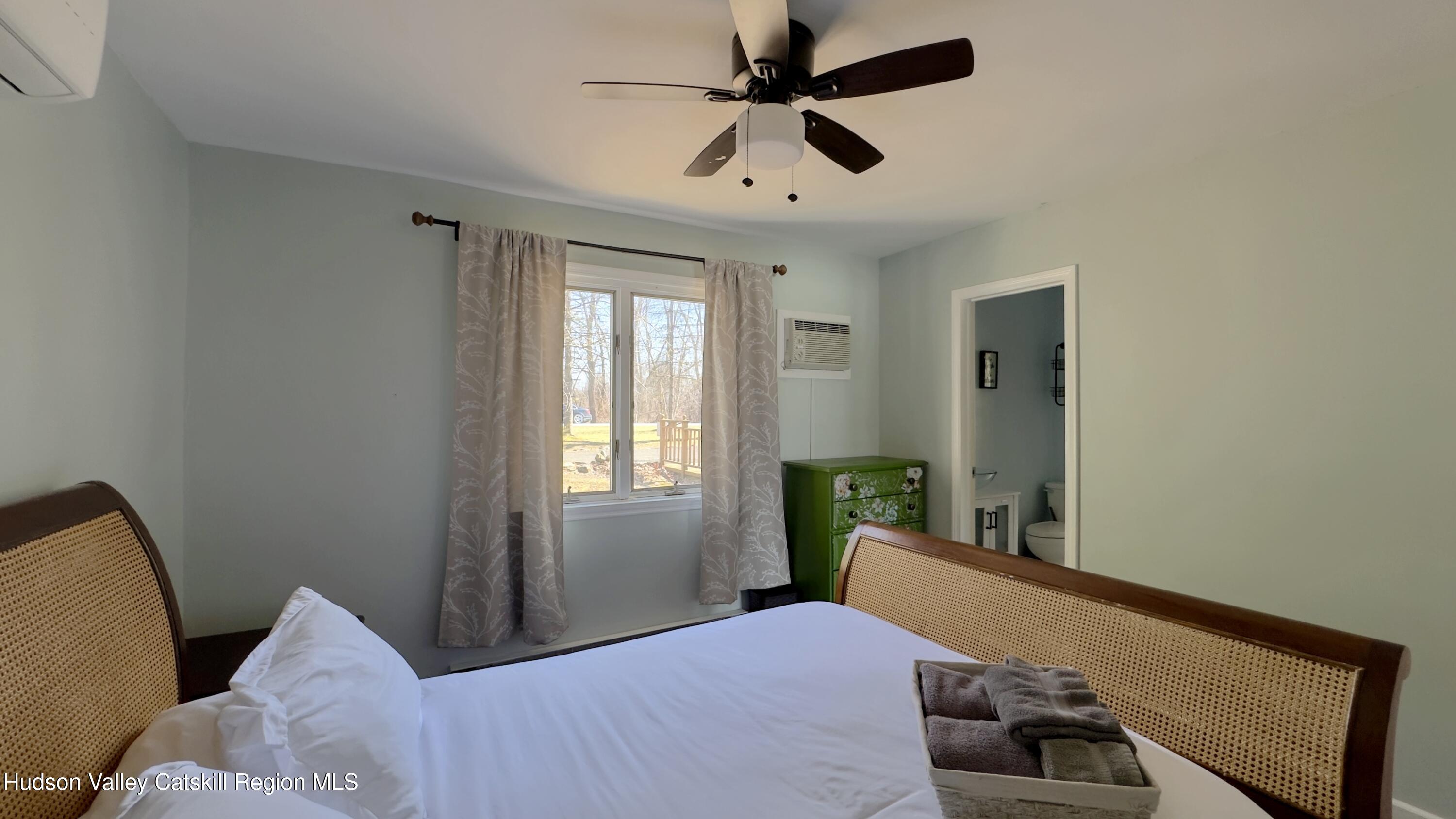 87 Sleepy Hollow Road Athens, NY 12015 - Photo 14 of 42 a bedroom with a bed and a window