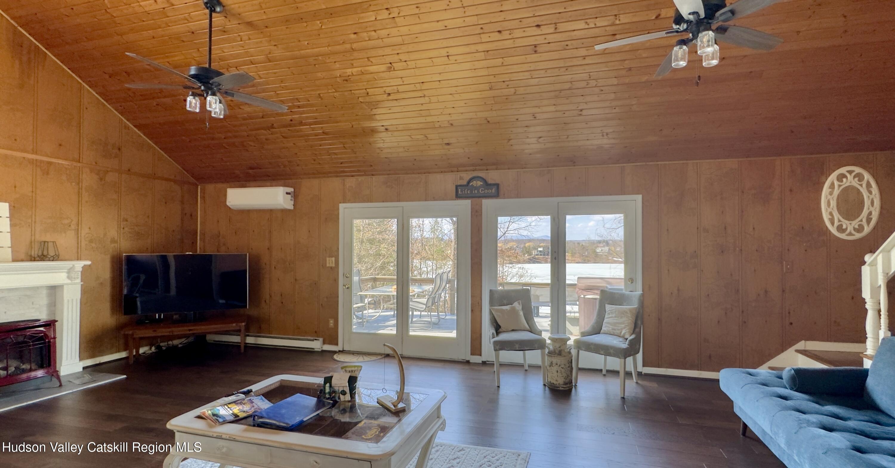 87 Sleepy Hollow Road Athens, NY 12015 - Photo 17 of 42 a living room with furniture and a fireplace