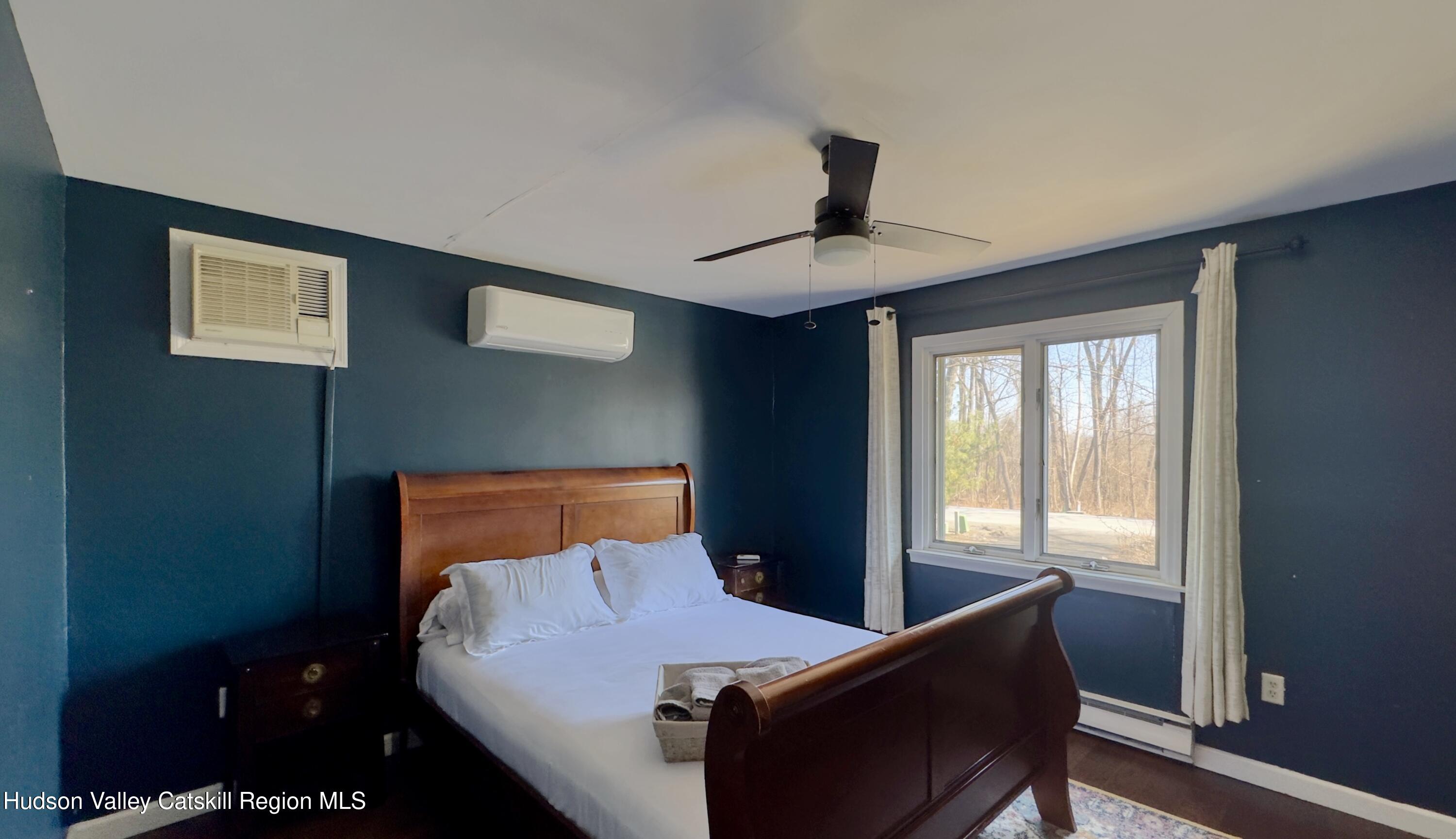 87 Sleepy Hollow Road Athens, NY 12015 - Photo 20 of 42 a bedroom with a bed and a window