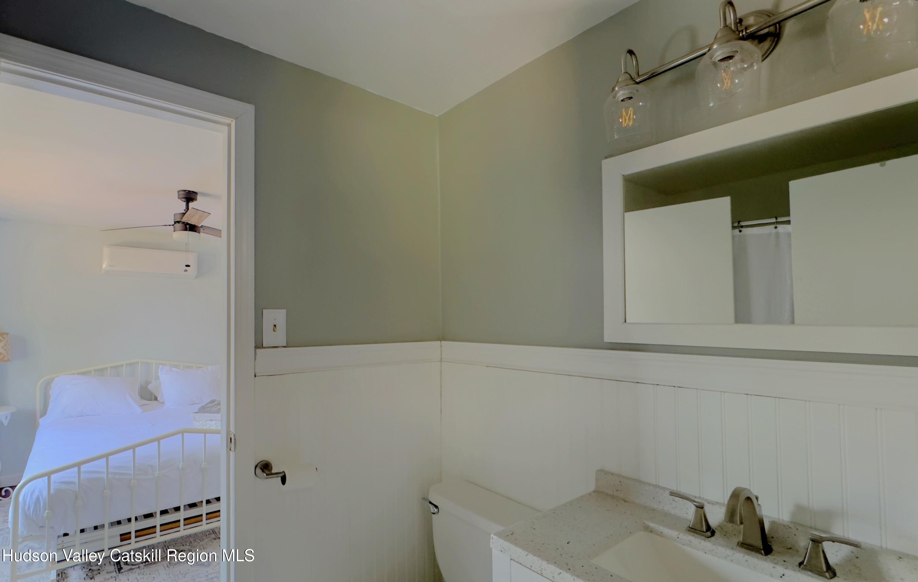 87 Sleepy Hollow Road Athens, NY 12015 - Photo 26 of 42 a bathroom with a sink and cabinets