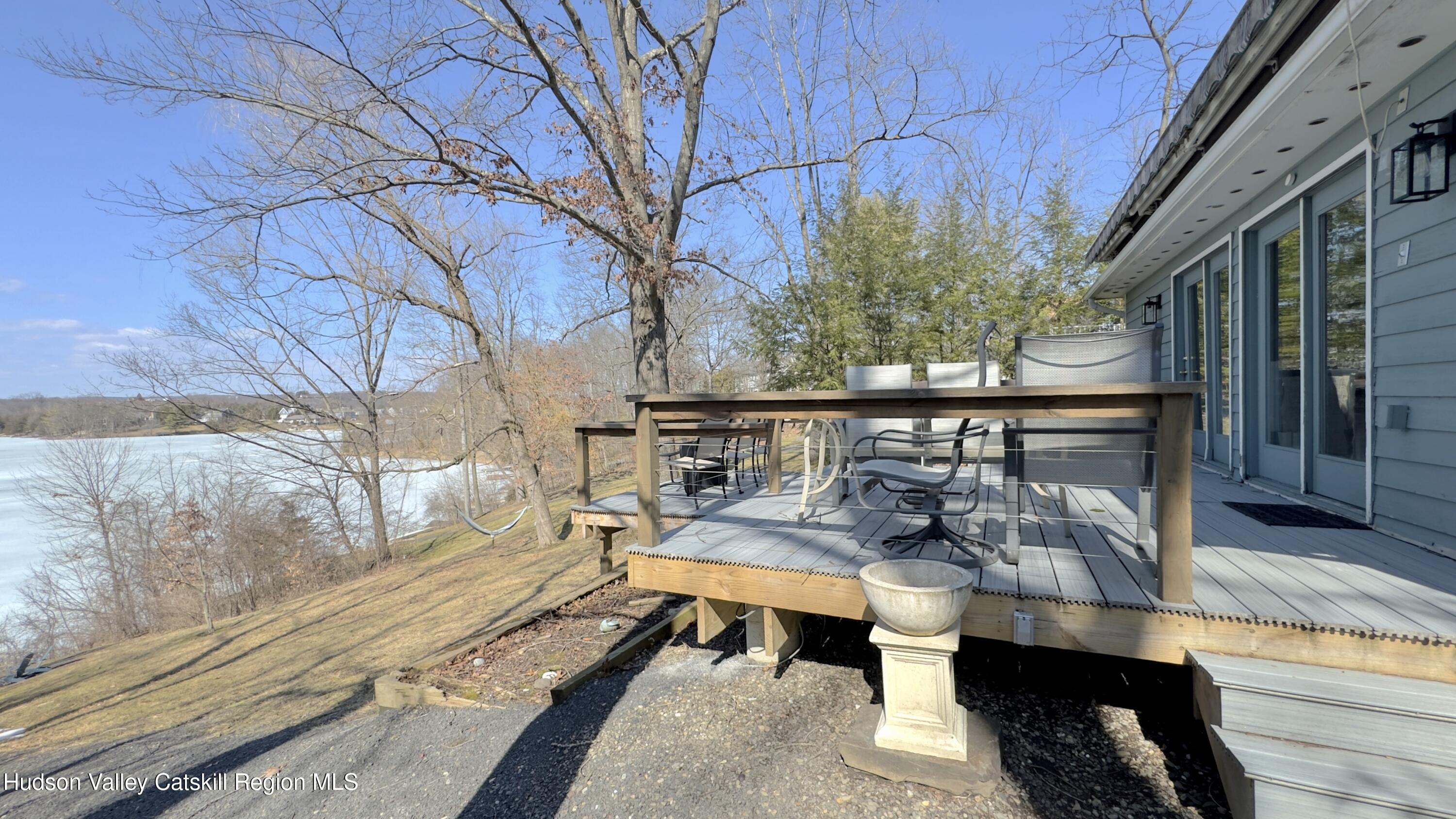 87 Sleepy Hollow Road Athens, NY 12015 - Photo 32 of 42 a balcony with furniture and a potted plant