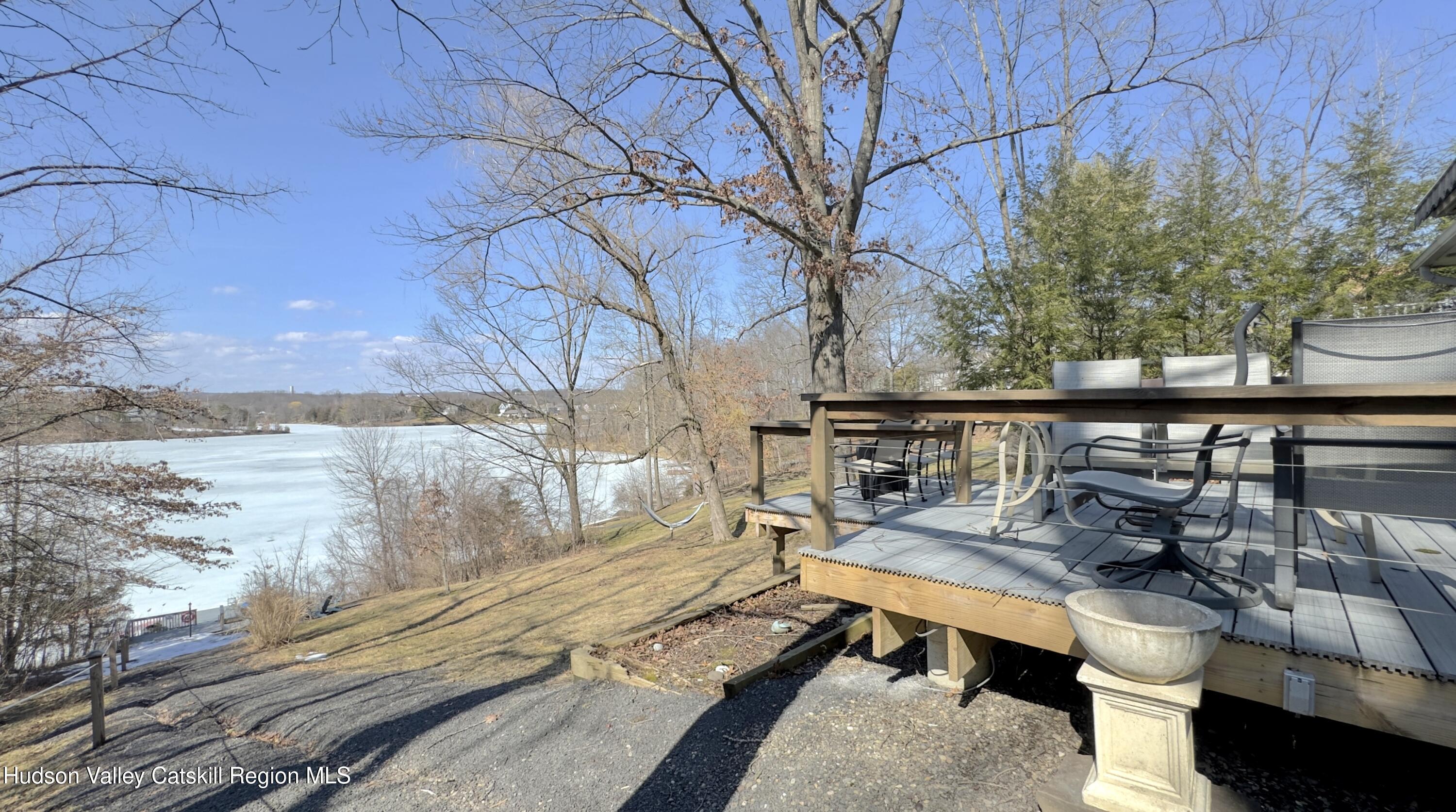 87 Sleepy Hollow Road Athens, NY 12015 - Photo 33 of 42 a balcony with wooden floor and outdoor seating