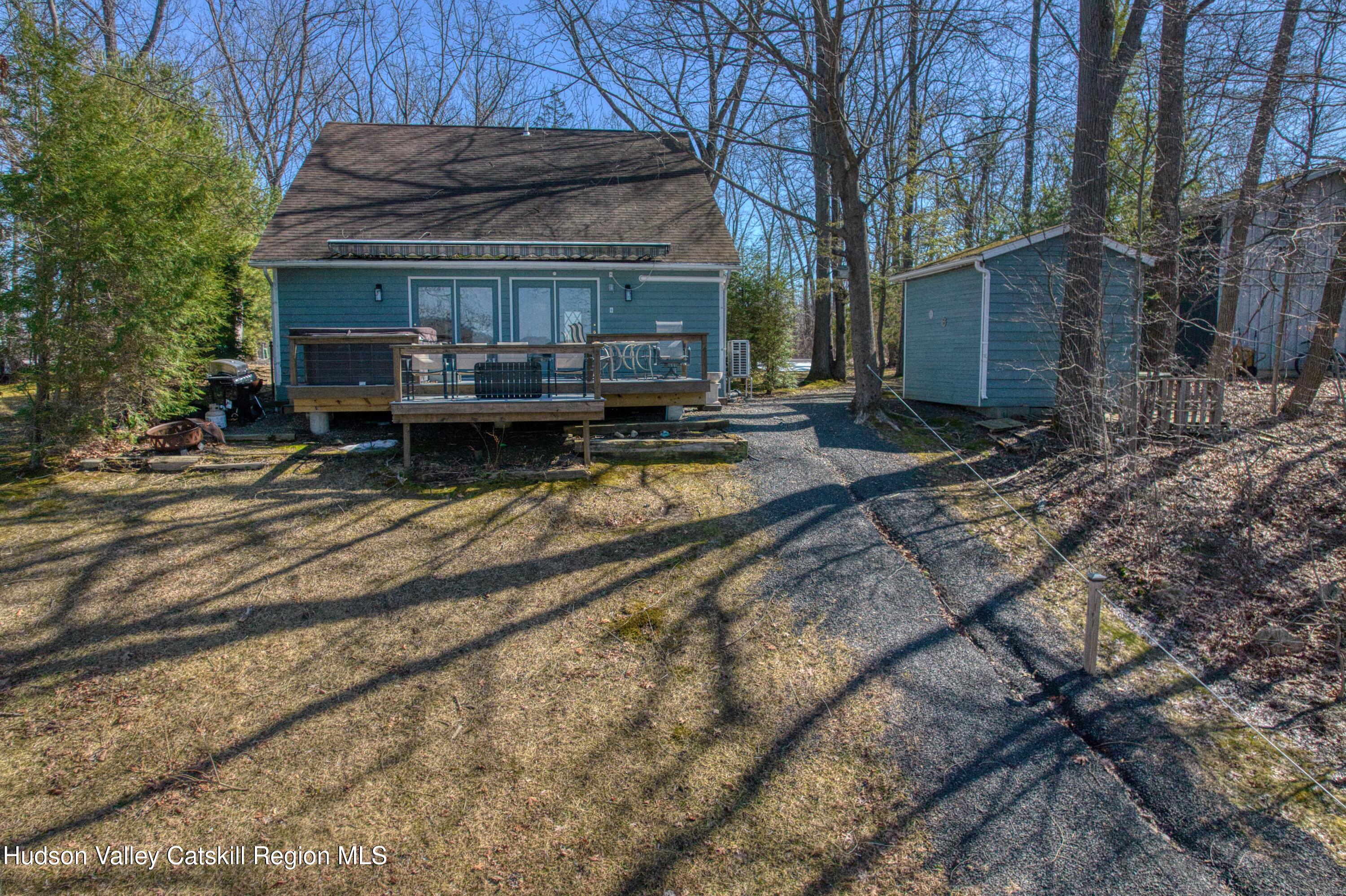 87 Sleepy Hollow Road Athens, NY 12015 - Photo 37 of 42 a view of backyard with wooden fence and large trees