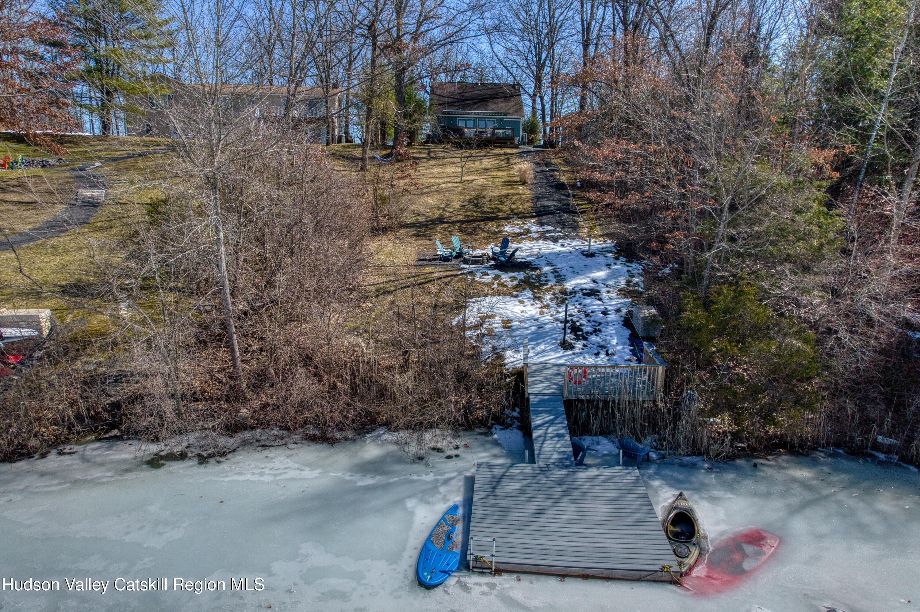 87 Sleepy Hollow Road Athens, NY 12015 - Photo 38 of 42 a backyard of a house with outdoor seating