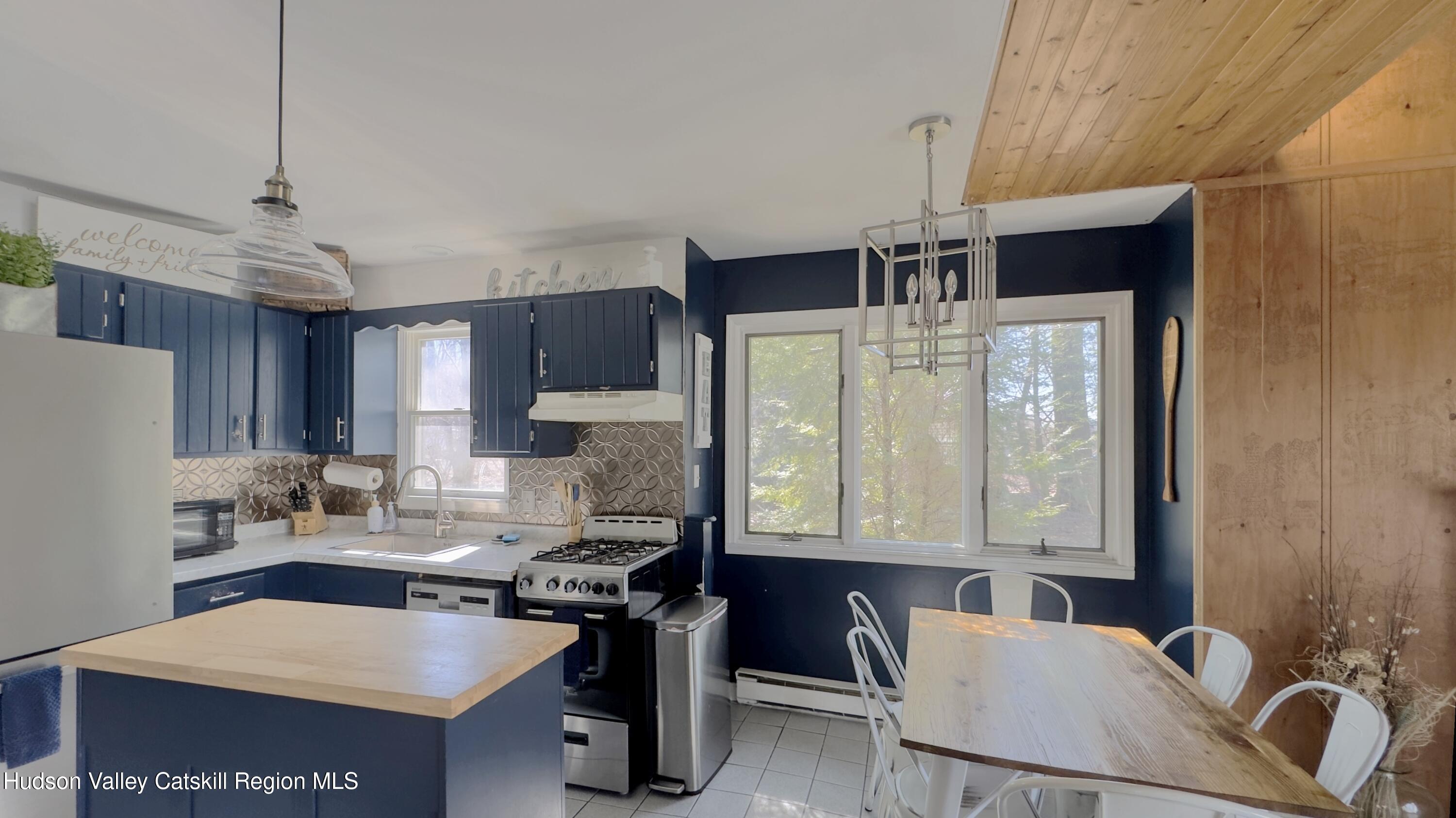 87 Sleepy Hollow Road Athens, NY 12015 - Photo 8 of 42 a kitchen with a stove a sink and a refrigerator
