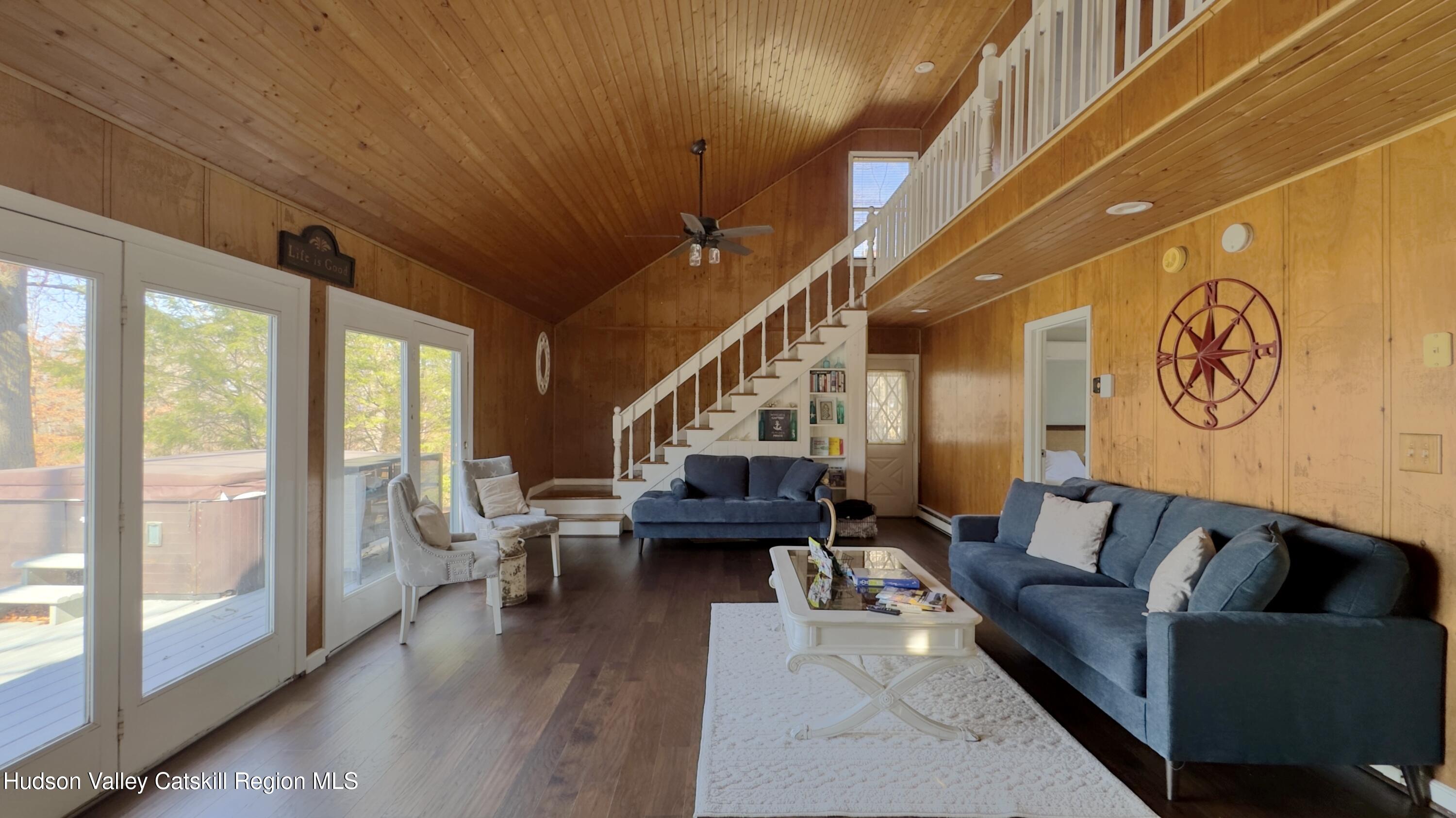 87 Sleepy Hollow Road Athens, NY 12015 - Photo 10 of 42 a living room with furniture and a large window