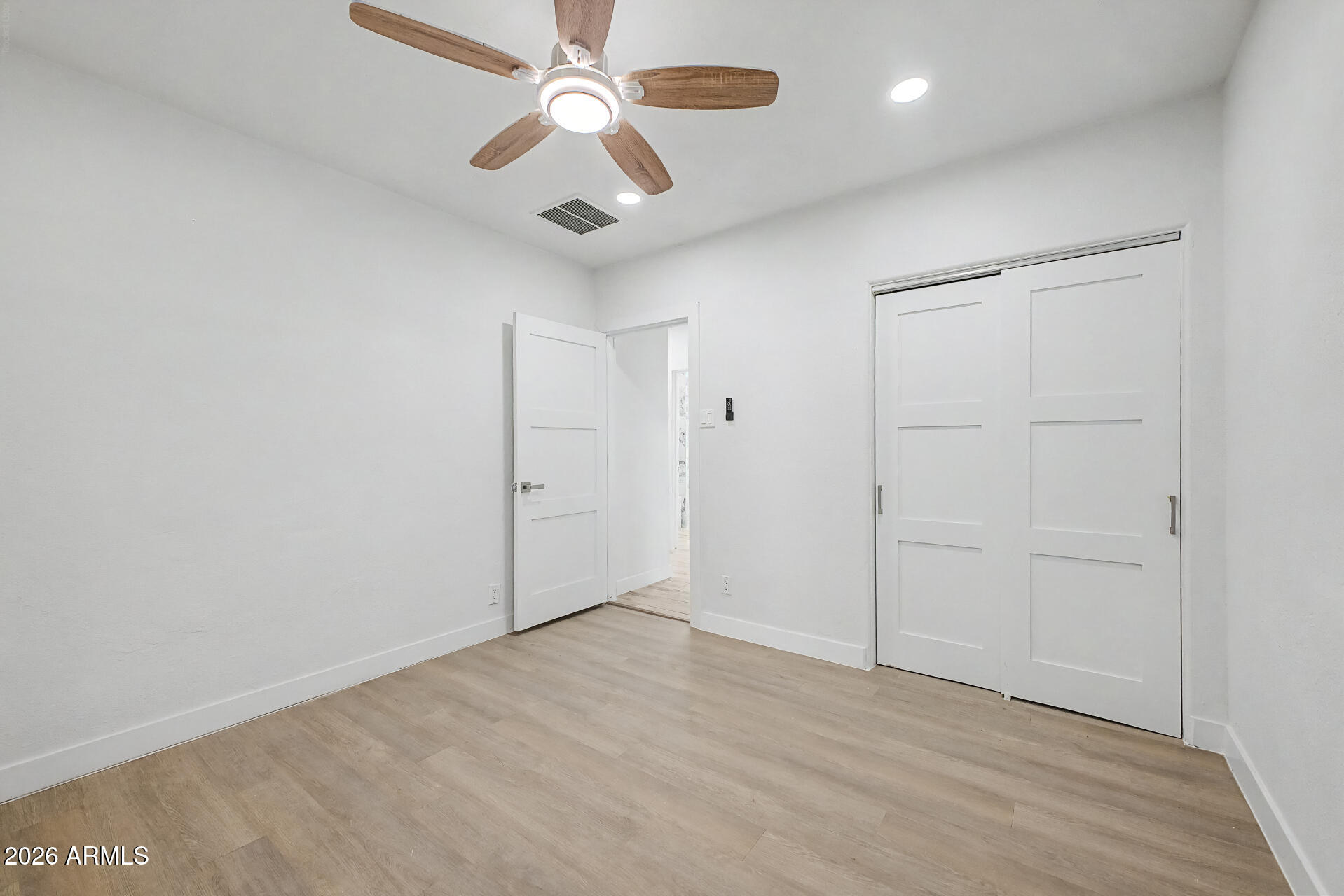 532 East Cheery Lynn Road Phoenix, AZ 85014 - Photo 22 of 37 an empty room with fan and a ceiling fan