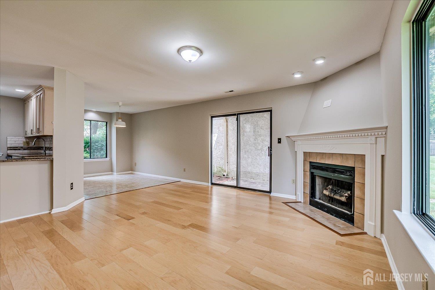 83 Park Gate Drive Edison, NJ 08820 - Photo 17 of 35 a view of an empty room with window and fireplace