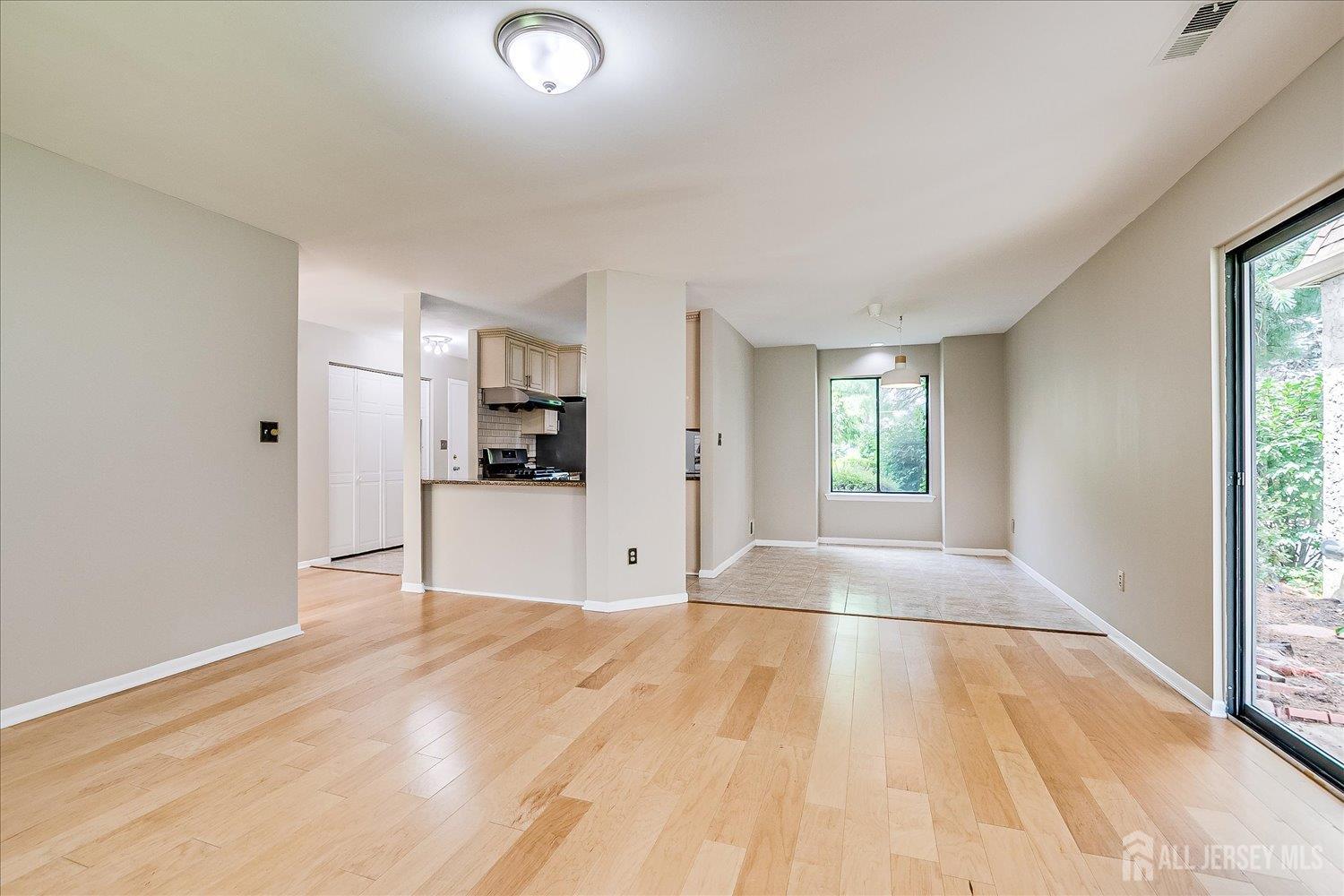 83 Park Gate Drive Edison, NJ 08820 - Photo 18 of 35 a view of empty room with wooden floor and window