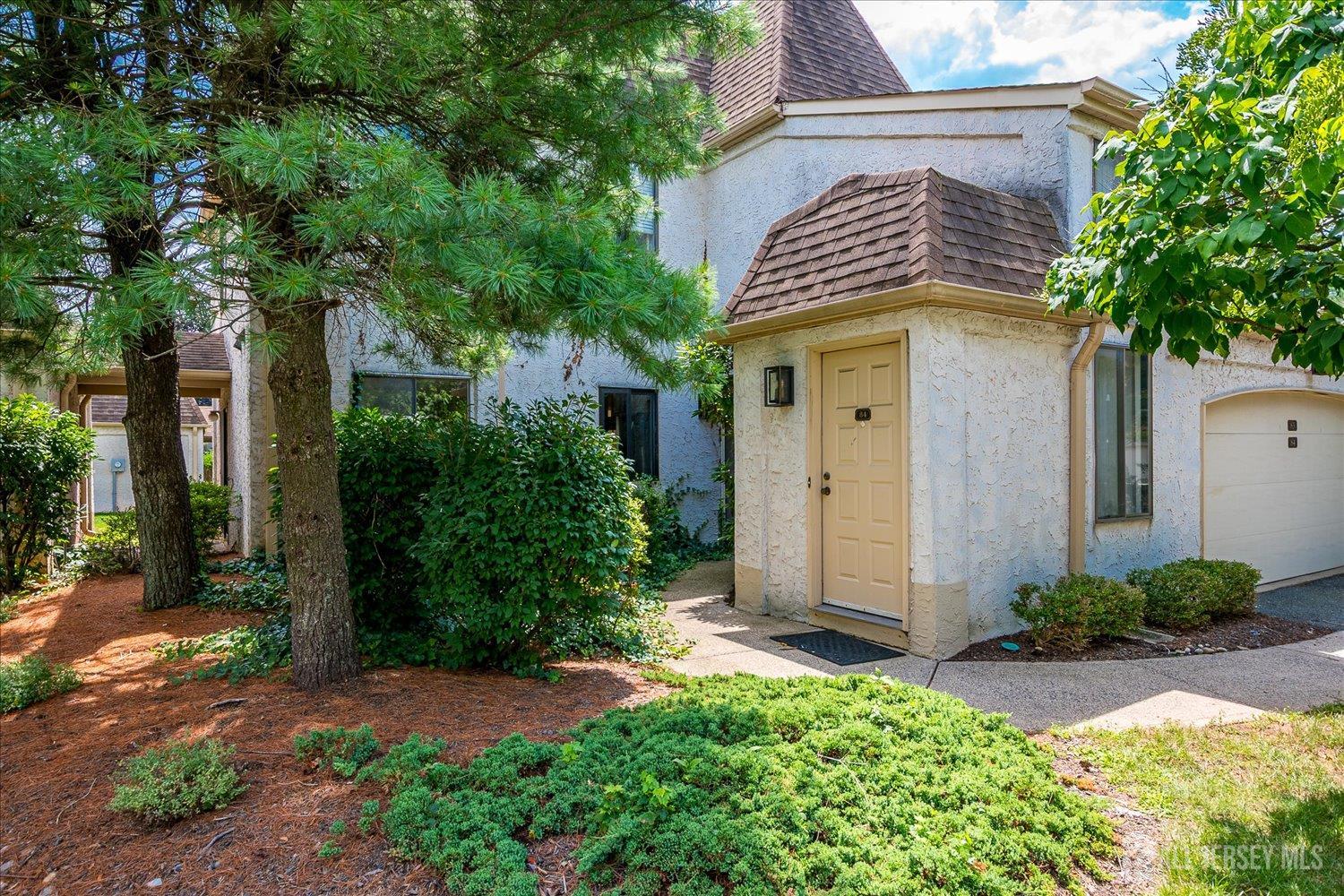 83 Park Gate Drive Edison, NJ 08820 - Photo 2 of 35 a front view of a house with garden