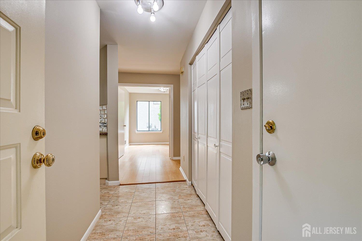 83 Park Gate Drive Edison, NJ 08820 - Photo 10 of 35 a view of a hallway with wooden floor