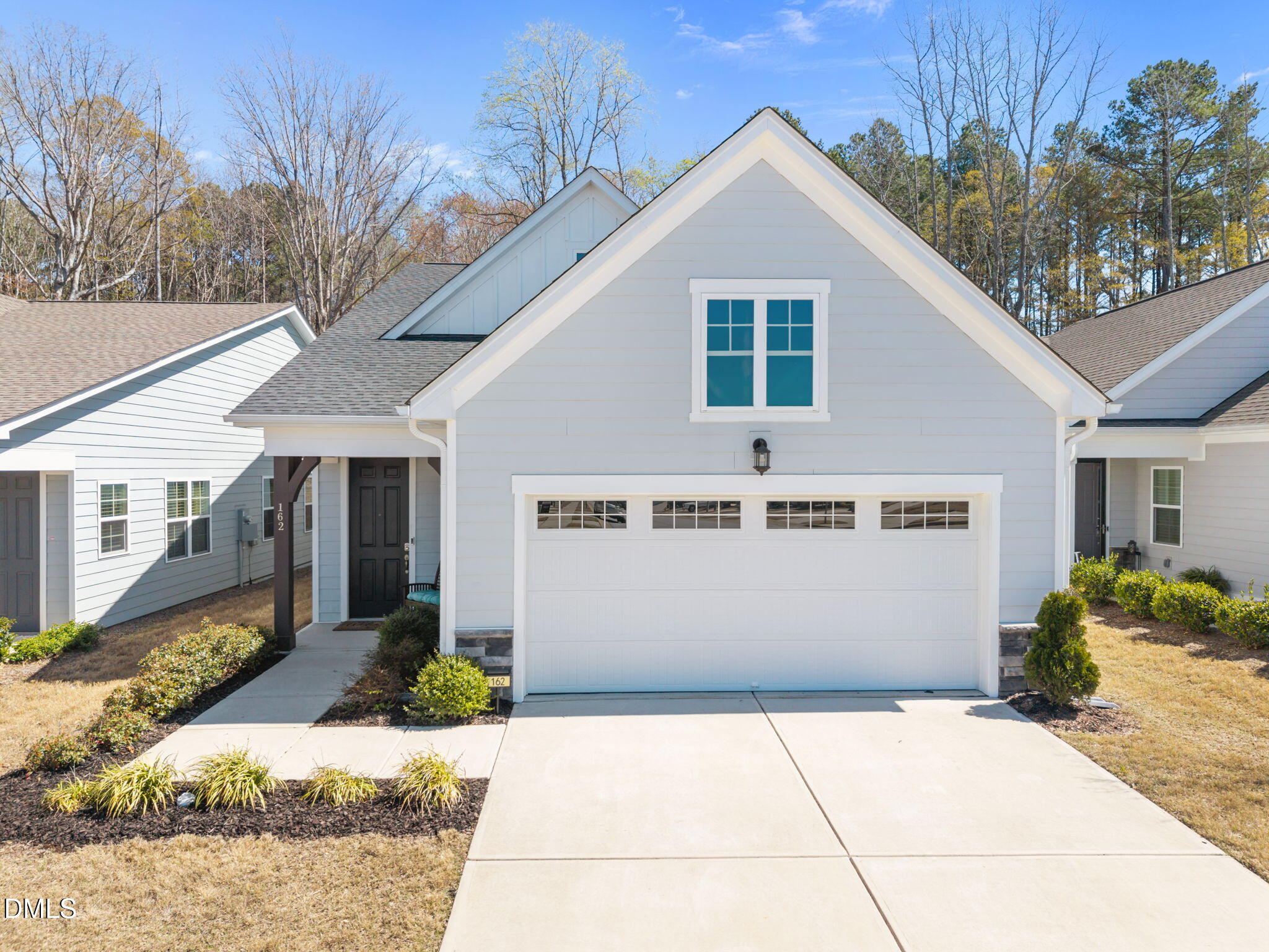 a front view of a house with a garage