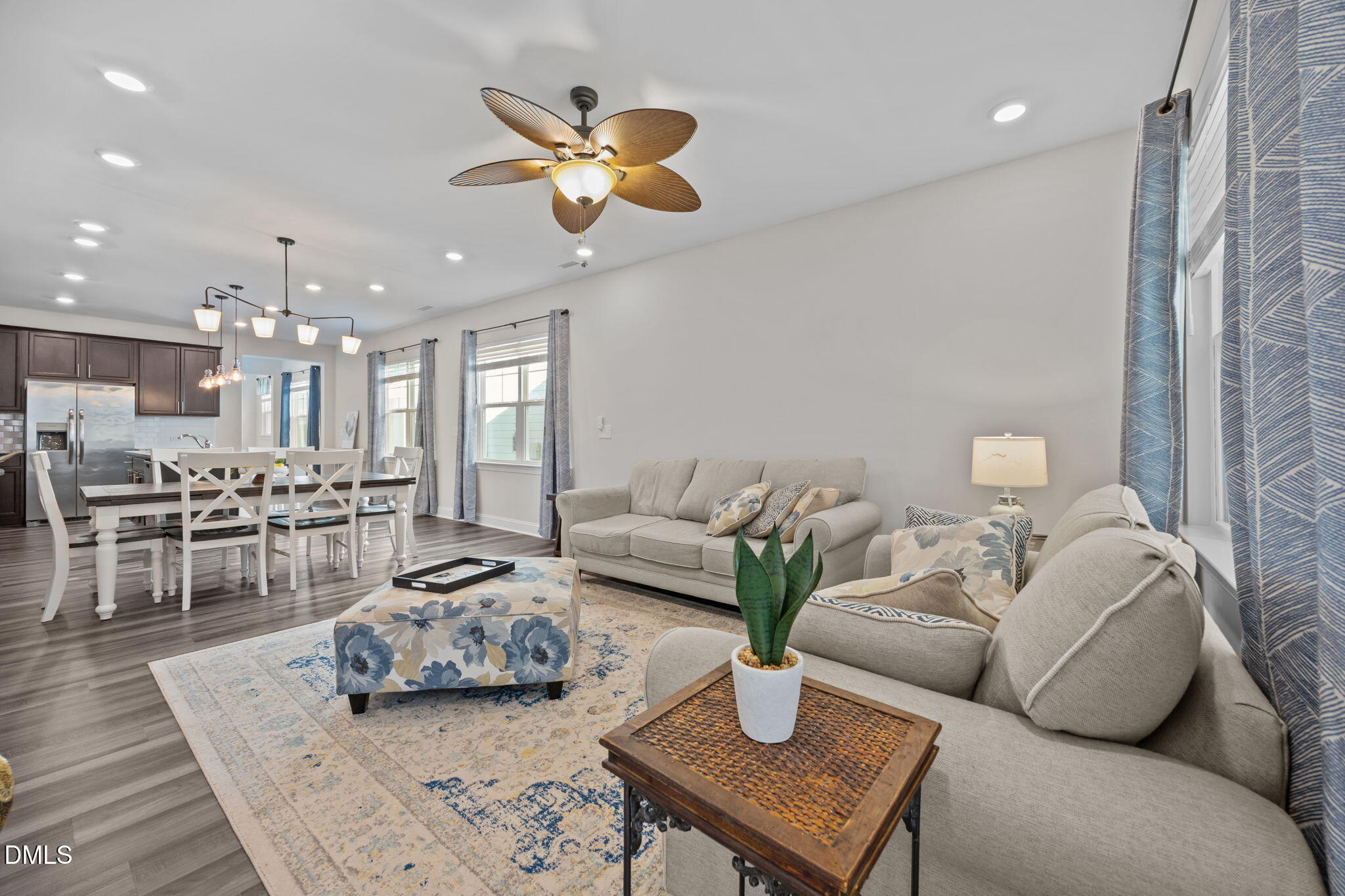 162 Desert Sand Lane Raleigh, NC 27610 - Photo 15 of 33 a living room with furniture kitchen and a chandelier