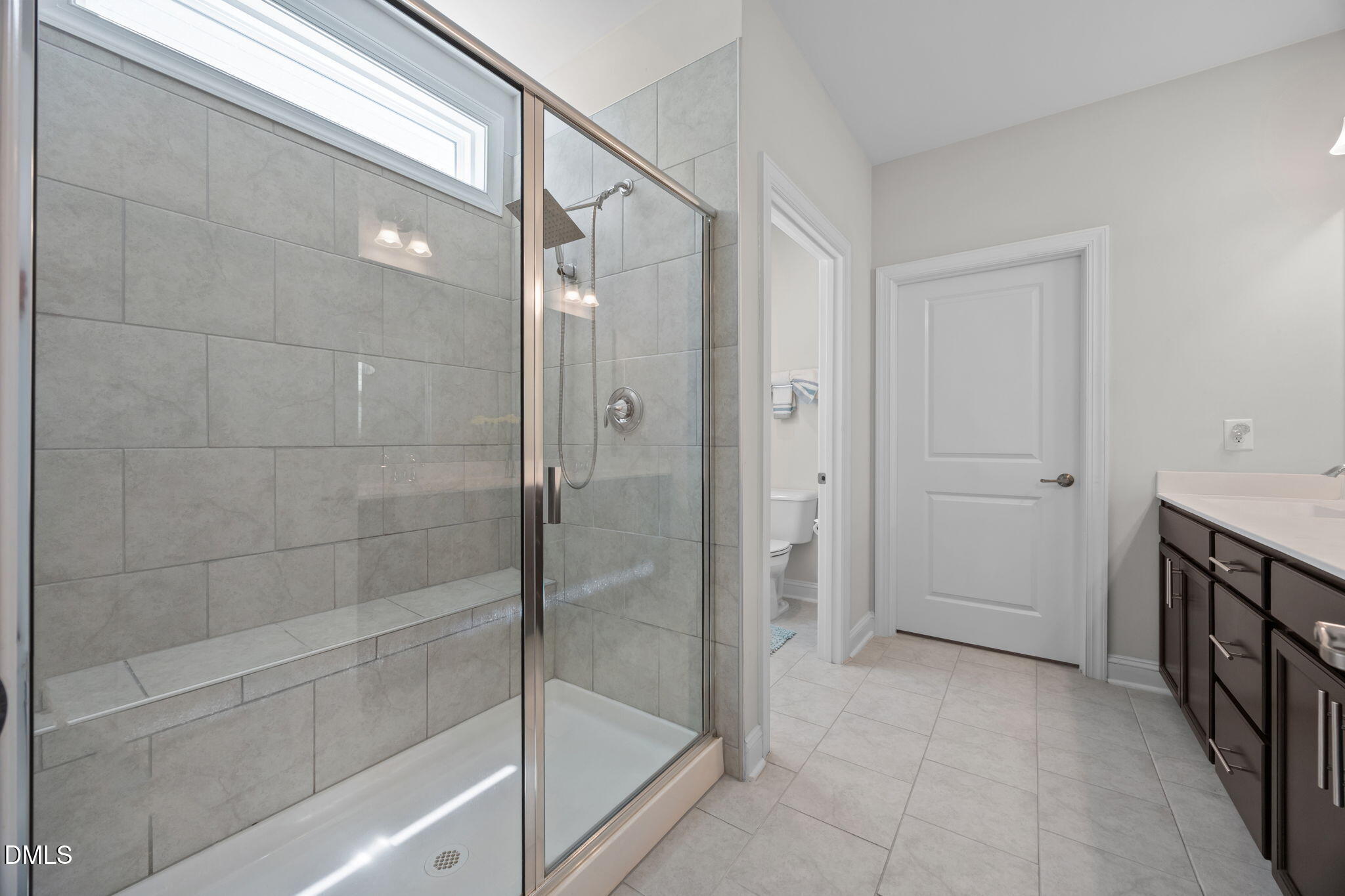 162 Desert Sand Lane Raleigh, NC 27610 - Photo 18 of 33 a bathroom with a shower and a sink