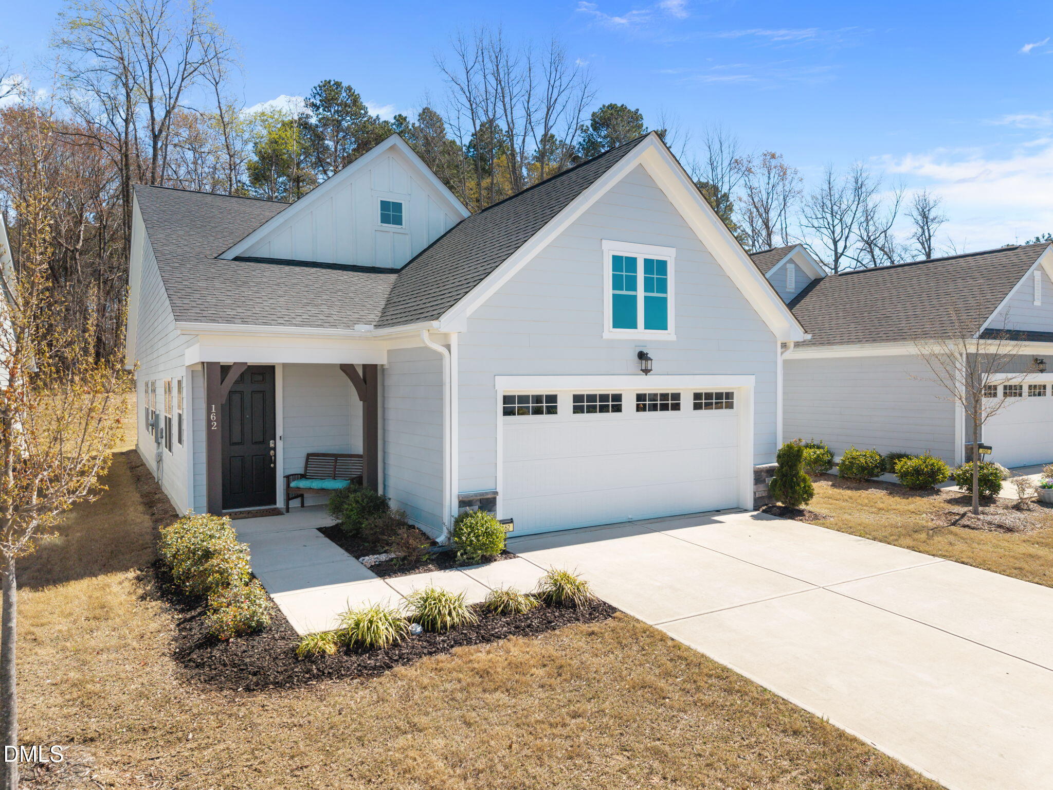 162 Desert Sand Lane Raleigh, NC 27610 - Photo 2 of 33 a front view of a house with a yard outdoor seating and garage