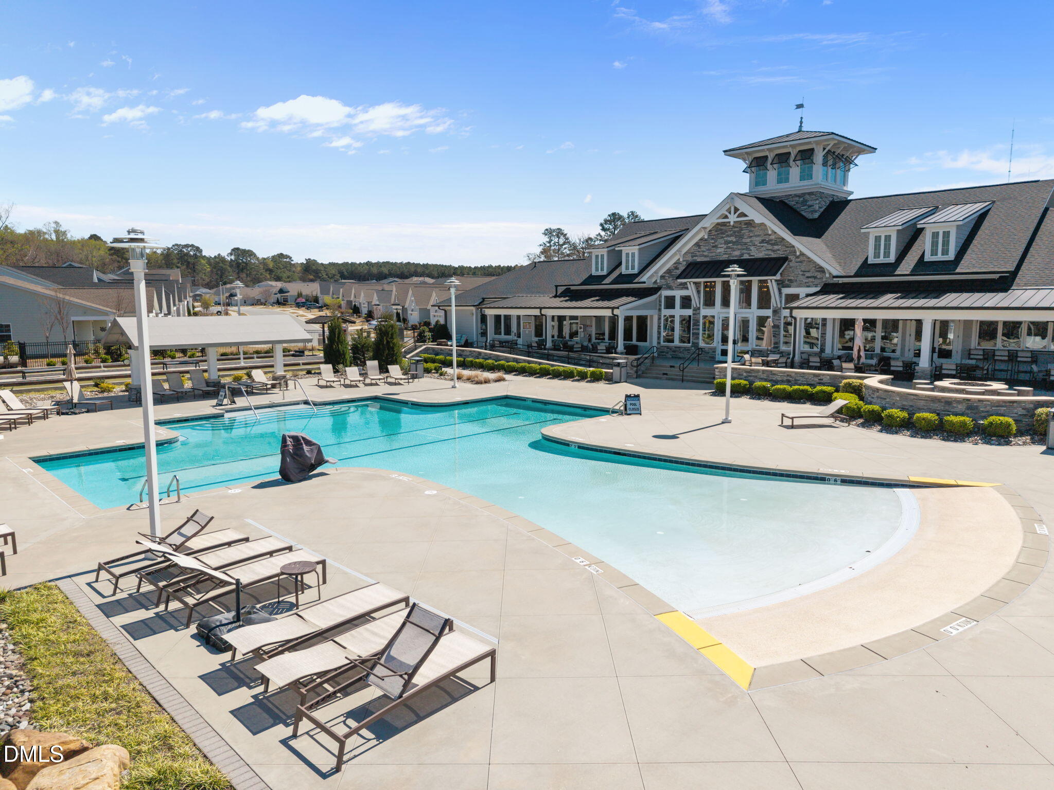162 Desert Sand Lane Raleigh, NC 27610 - Photo 24 of 33 a view of a swimming pool with lounge chairs in front of house