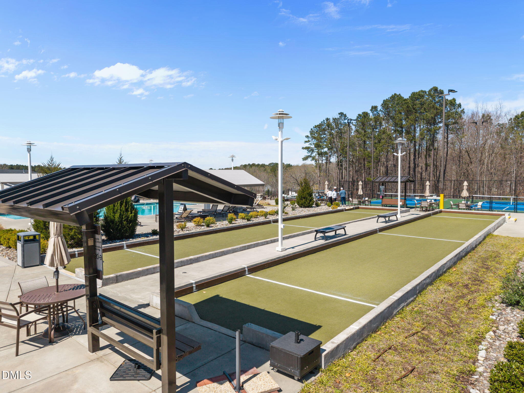 162 Desert Sand Lane Raleigh, NC 27610 - Photo 28 of 33 a view of a tennis ground with a large tree