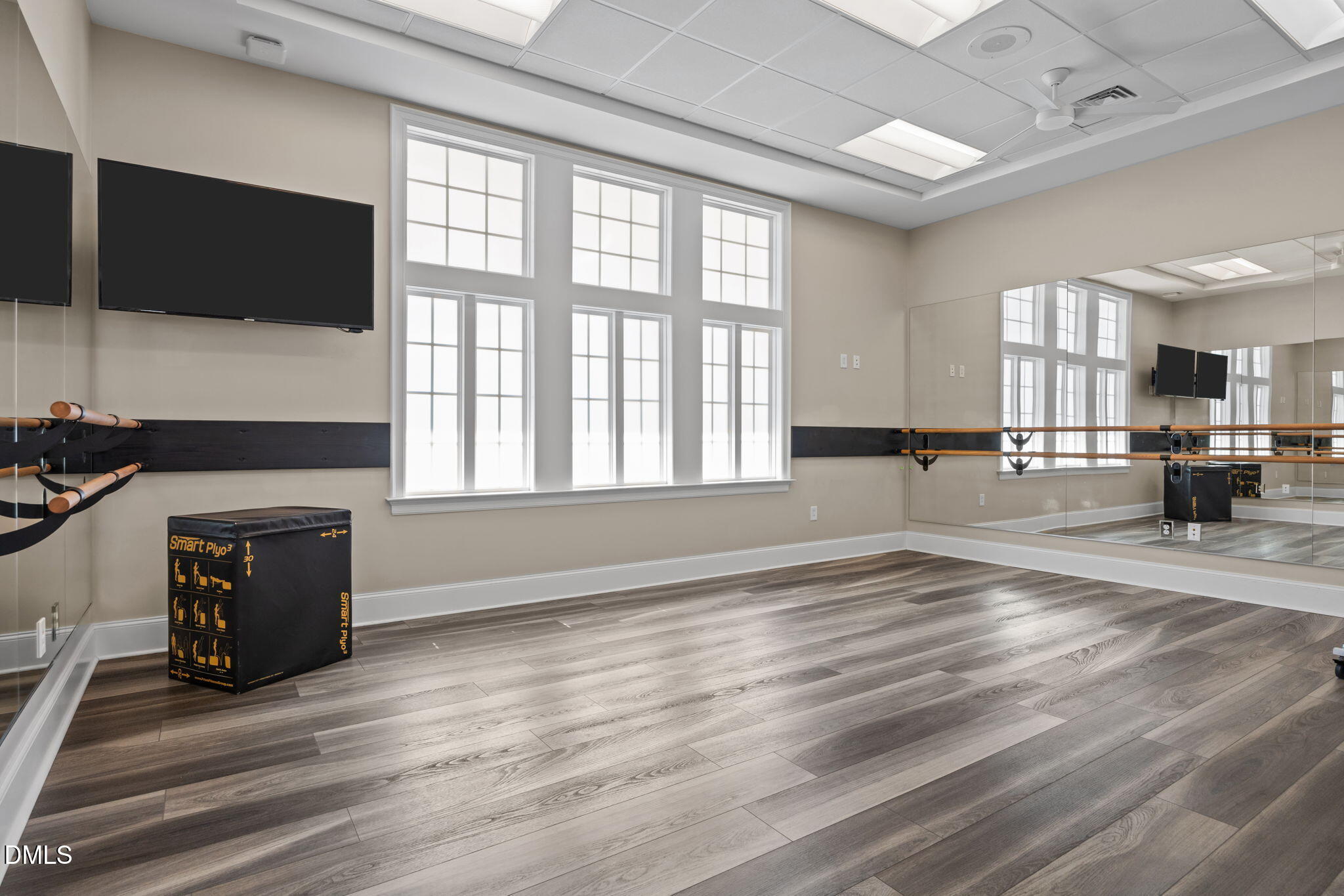 162 Desert Sand Lane Raleigh, NC 27610 - Photo 32 of 33 a view of empty room with wooden floor and fireplace