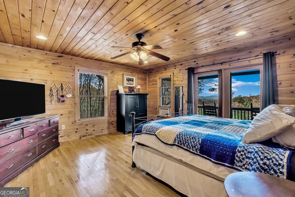 116 Channing Ridge Road, Unit 10 Morganton, GA 30560 - Photo 16 of 62 a bedroom with furniture and a flat screen tv