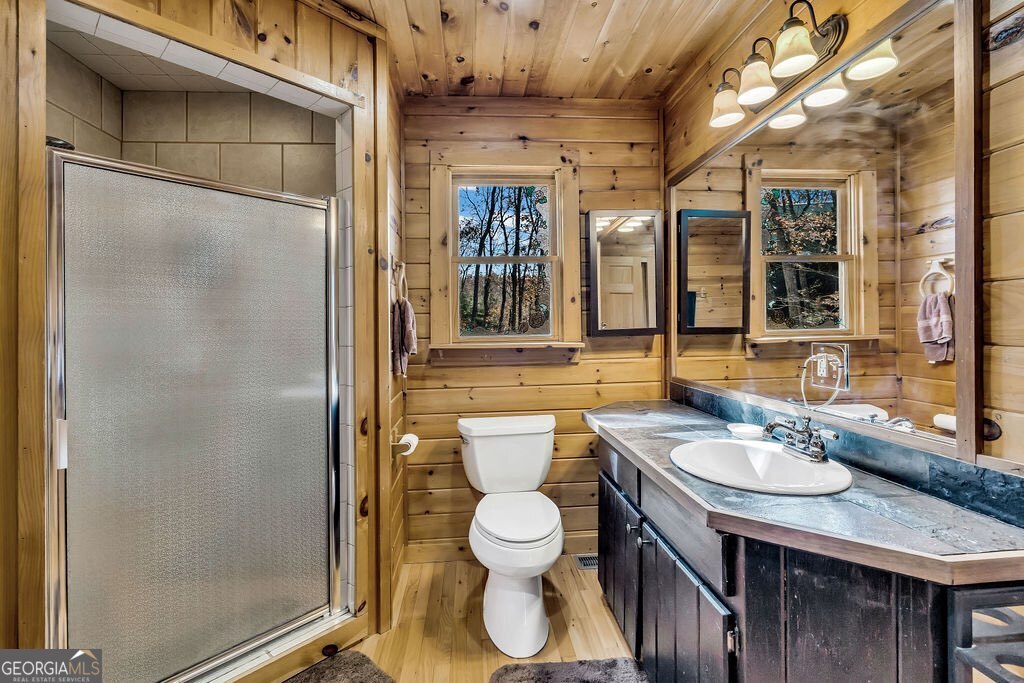 116 Channing Ridge Road, Unit 10 Morganton, GA 30560 - Photo 21 of 63 a bathroom with a toilet a sink and mirror