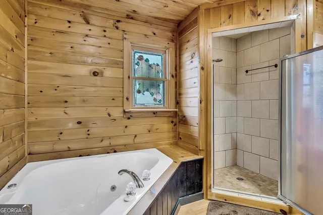 a livingroom with furniture and a flat screen tv