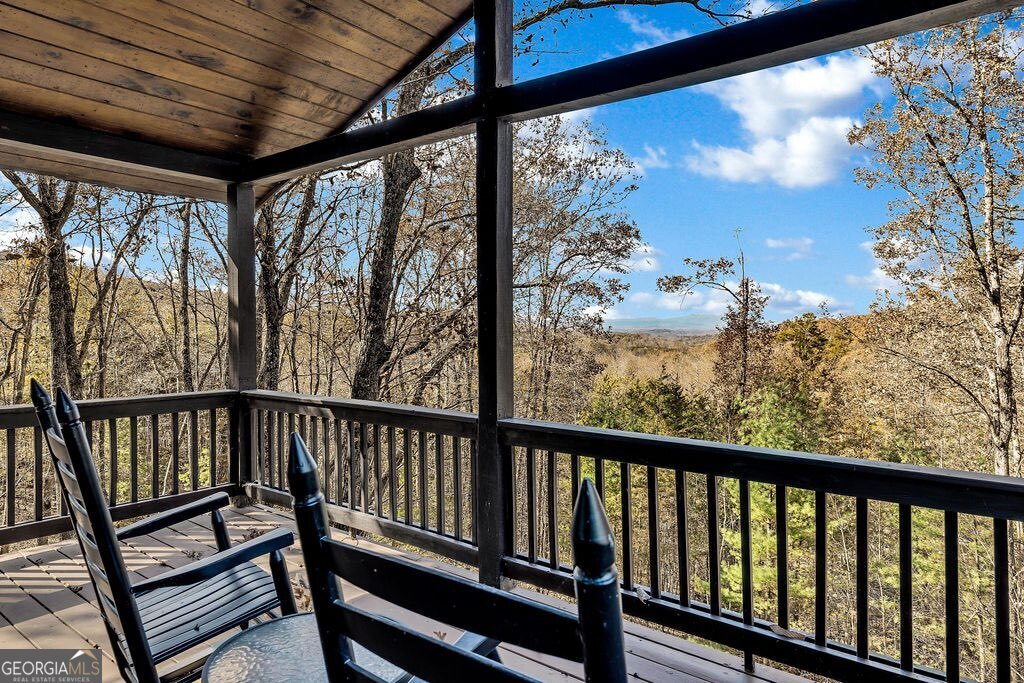 116 Channing Ridge Road, Unit 10 Morganton, GA 30560 - Photo 22 of 62 a view of a two chairs in the balcony