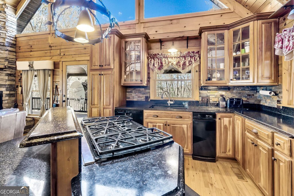 116 Channing Ridge Road, Unit 10 Morganton, GA 30560 - Photo 4 of 62 a kitchen with a stove a sink and a wooden cabinets