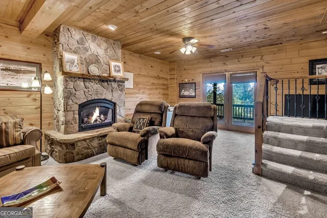 a view of a porch with wooden floor and outdoor seating