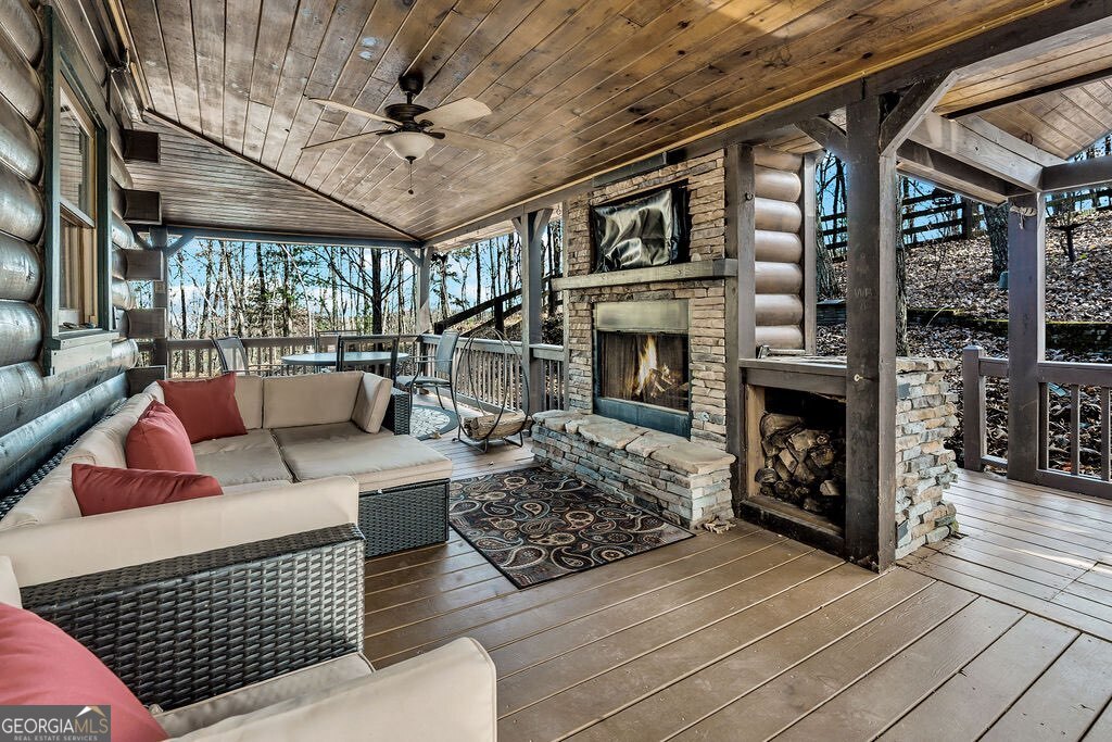 116 Channing Ridge Road, Unit 10 Morganton, GA 30560 - Photo 48 of 63 a living room with furniture a fireplace and a table