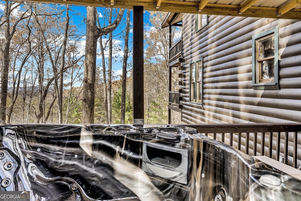116 Channing Ridge Road, Unit 10 Morganton, GA 30560 - Photo 50 of 62 a backyard of a house with barbeque oven table and chairs