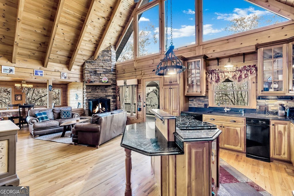 116 Channing Ridge Road, Unit 10 Morganton, GA 30560 - Photo 5 of 62 a living room with furniture a fireplace and kitchen view