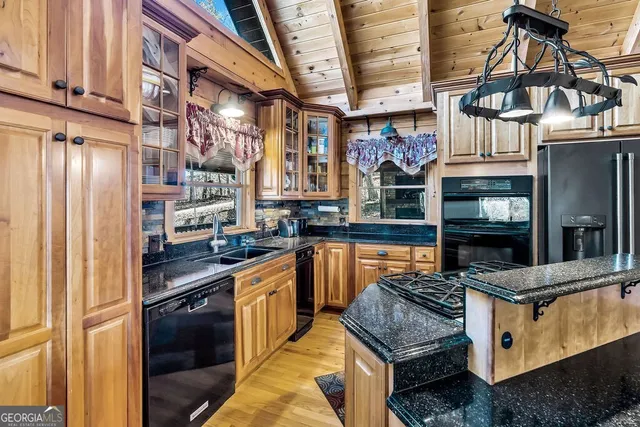 a stove top oven sitting inside of a kitchen