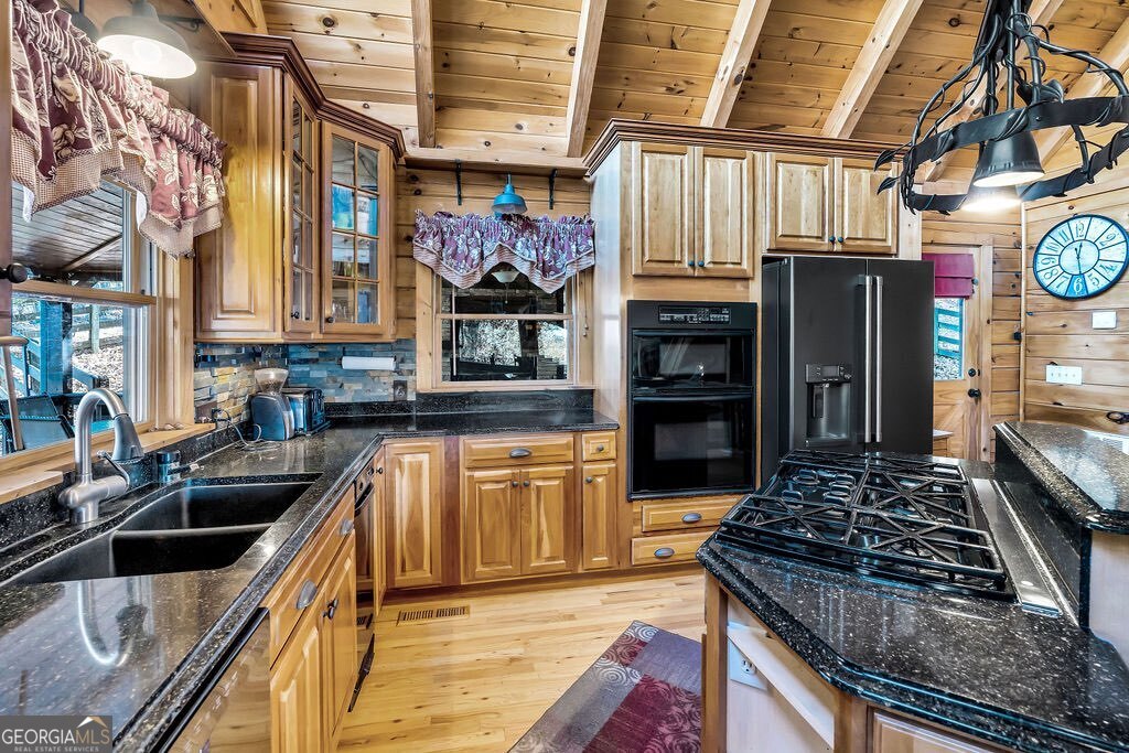 116 Channing Ridge Road, Unit 10 Morganton, GA 30560 - Photo 8 of 63 a kitchen with stainless steel appliances granite countertop a stove and a sink