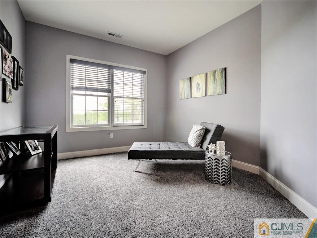 17 Thompson Grove Road Freehold, NJ 07728 - Photo 13 of 25 a living room with furniture and a window
