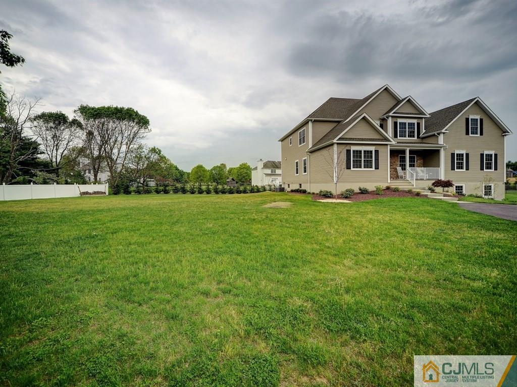 17 Thompson Grove Road Freehold, NJ 07728 - Photo 20 of 25 a house that has a big yard