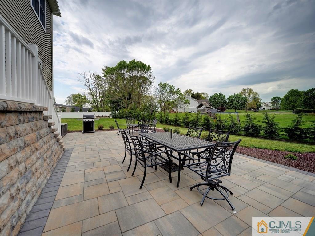 17 Thompson Grove Road Freehold, NJ 07728 - Photo 21 of 25 a view of a backyard with furniture and a garden