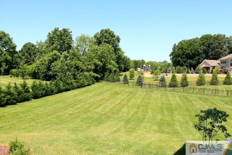 17 Thompson Grove Road Freehold, NJ 07728 - Photo 22 of 25 a view of an outdoor space and swimming pool