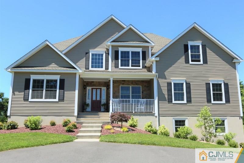 17 Thompson Grove Road Freehold, NJ 07728 - Photo 24 of 25 a front view of a house with garden