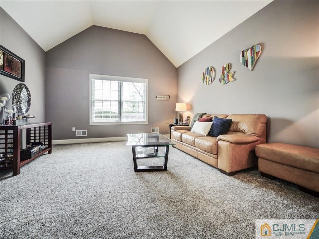 17 Thompson Grove Road Freehold, NJ 07728 - Photo 9 of 25 a living room with furniture and a window