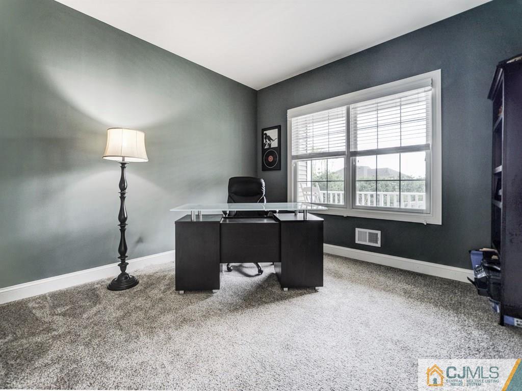 17 Thompson Grove Road Freehold, NJ 07728 - Photo 10 of 25 a living room with furniture and a window