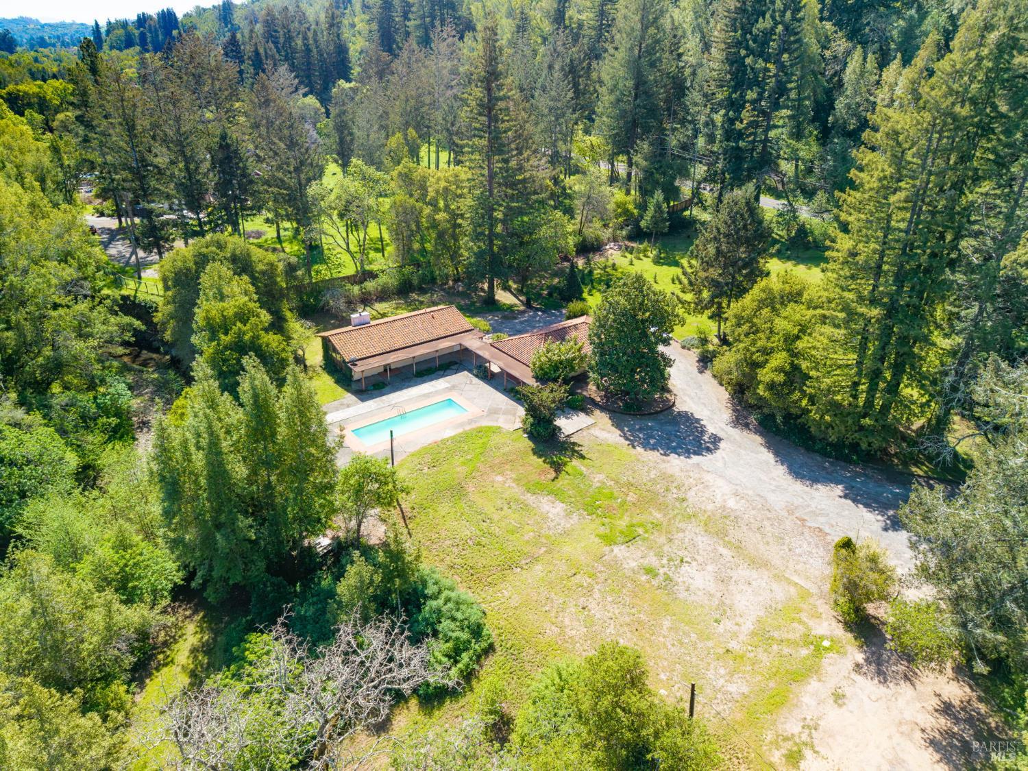 3320 Redwood Road Napa, CA 94558 - Photo 5 of 57 a backyard of a house with a yard and plants