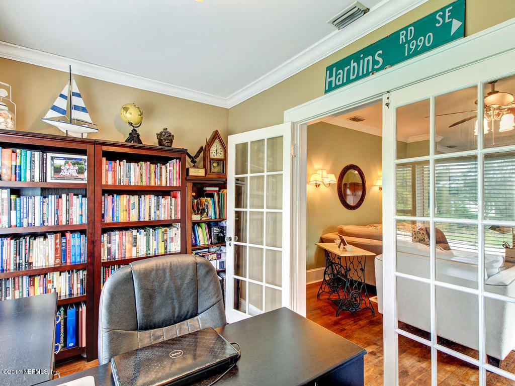 1511 Mayfair Road Jacksonville, FL 32207 - Photo 14 of 44 a living room with furniture and a book shelf