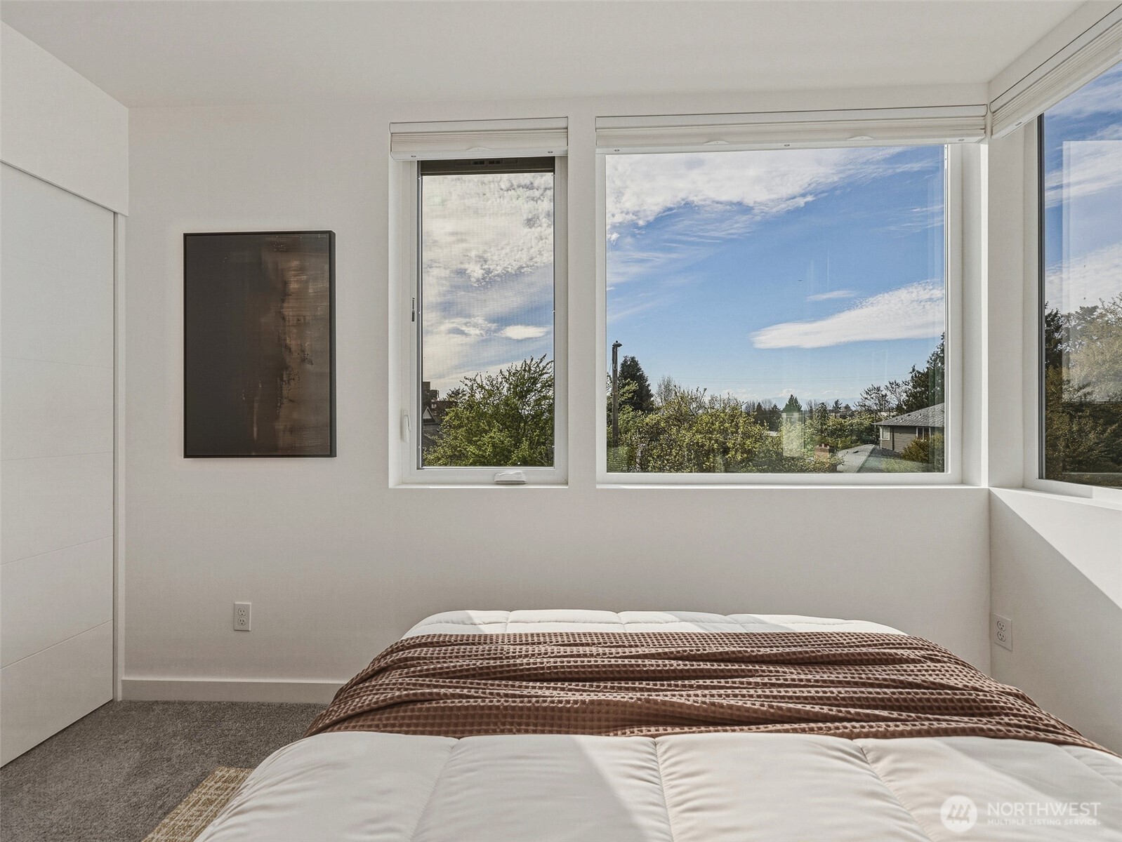 6320 41st Avenue Southwest, Unit A Seattle, WA 98136 - Photo 16 of 39 a view of a bedroom with wooden floor and a window