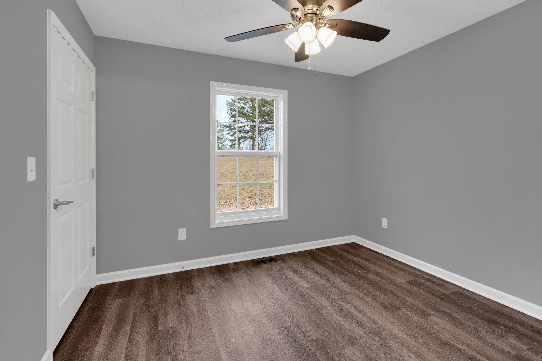 1332 Carter Blake Road Tullahoma, TN 37388 - Photo 15 of 31 wooden floor in an empty room with a window
